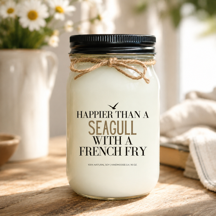 ALT TEXT – IMAGE 1

Happier Than A Seagull With A French Fry soy candle on a rustic cottage table with warm natural sunlight and cottage décor.