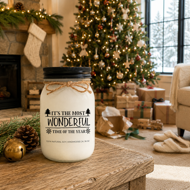 KINDMOOSE It’s the Most Wonderful Time of the Year candle in a cozy farmhouse family room decorated for Christmas morning.