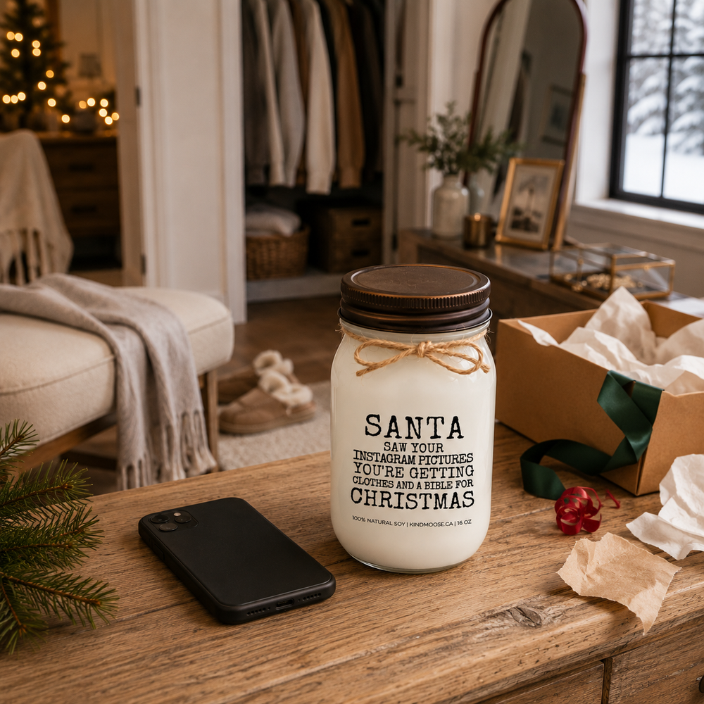 KINDMOOSE Santa Saw Your Instagram Pictures Christmas candle with distressed bronze lid styled in a farmhouse dressing room after opening Christmas gifts.