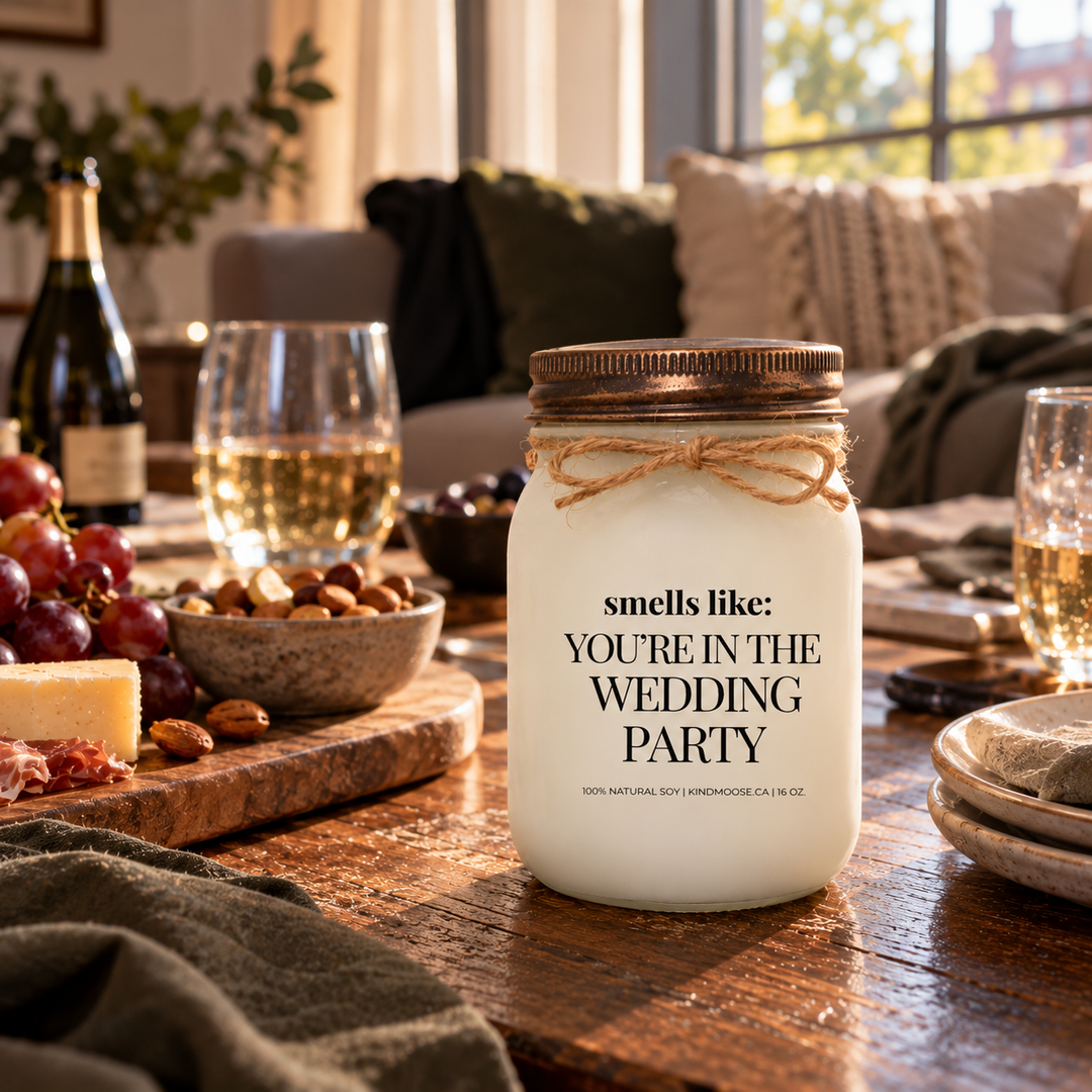 KINDMOOSE Smells Like You're in the Wedding Party candle with distressed bronze lid in a pre-wedding setting celebrating the wedding party.