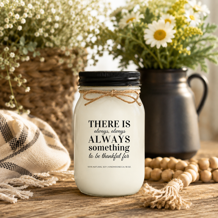 KINDMOOSE "There Is Always Something to Be Thankful For" 16 oz natural soy candle displayed on a rustic wooden table with fresh white flowers and cozy farmhouse décor.