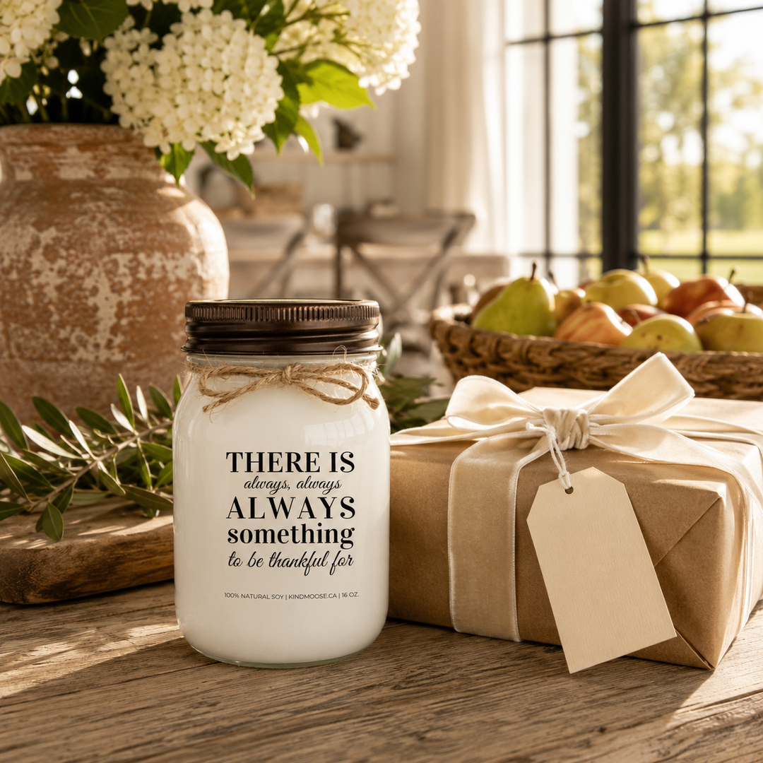 KINDMOOSE "There Is Always Something to Be Thankful For" 16 oz soy candle displayed beside a beautifully wrapped gift, perfect for meaningful gifting and expressing gratitude.