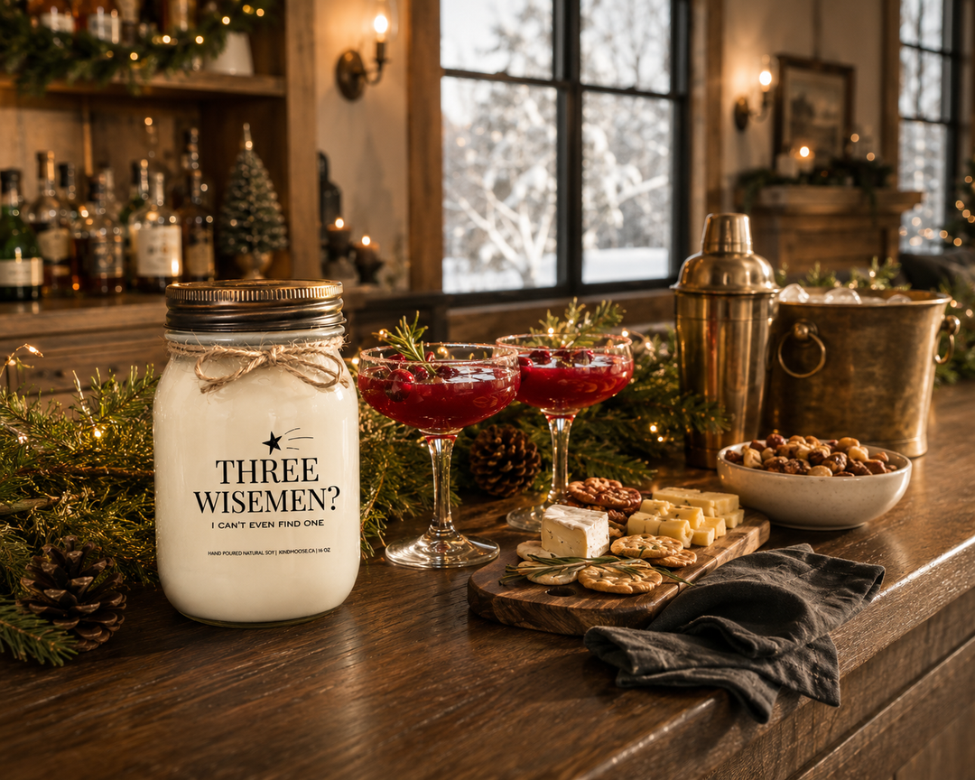 THREE WISE MEN? I CAN'T EVEN FIND ONE Christmas candle styled on a reclaimed walnut home bar with cranberry mocktails, artisan cheese board, cedar greenery, and elegant farmhouse entertaining décor before a festive Christmas gathering.